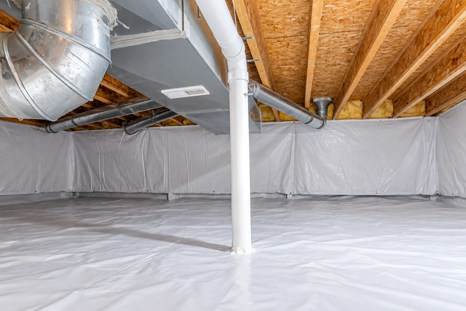 A crawl space has a white vapor barrier covering the ground and lower walls beneath exposed joists and ductwork.